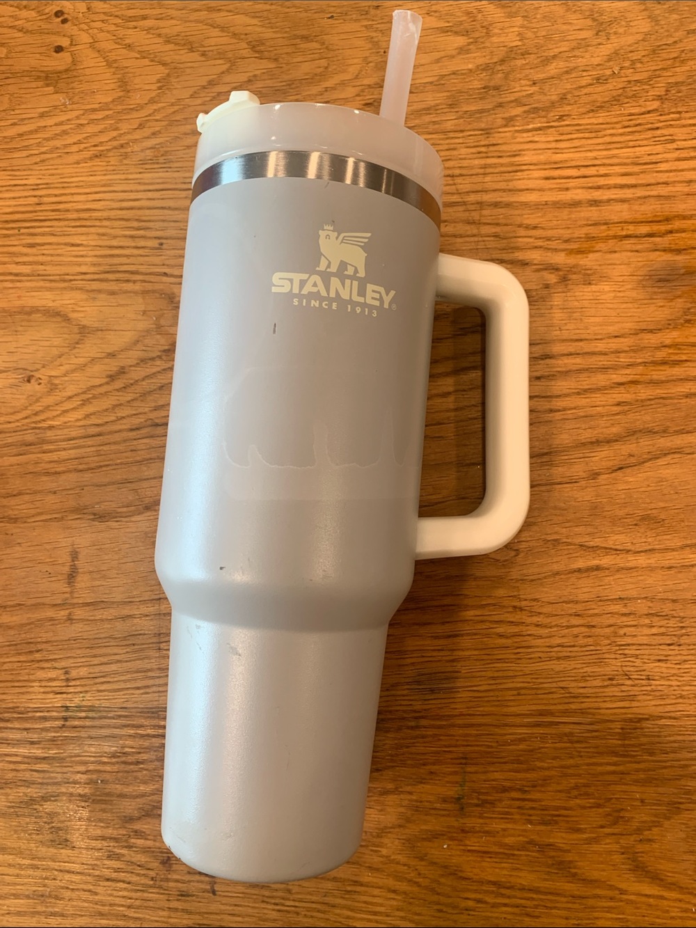 Well loved Stanley Light Gray Travel Mug with Handle and Straw
